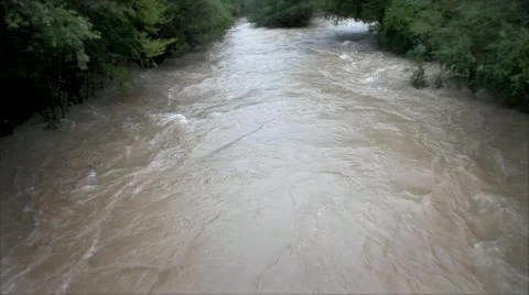 View of the increased mudy river Stock Footage 27734417