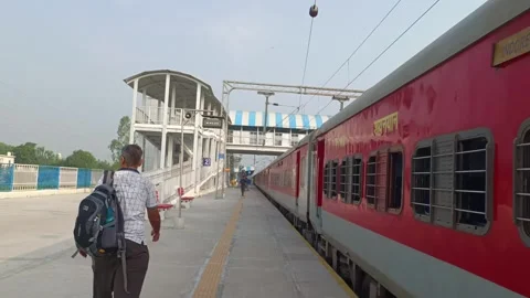 A view of Indian Railway platform having a train parked Видео 340193172
