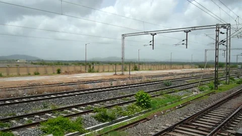 View from Indian railway Train moving Arriving old scenic station platform India Stock Footage 137619878