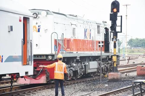 View of the Indonesian train (KAI) running on the railroad tracks Stock Photos