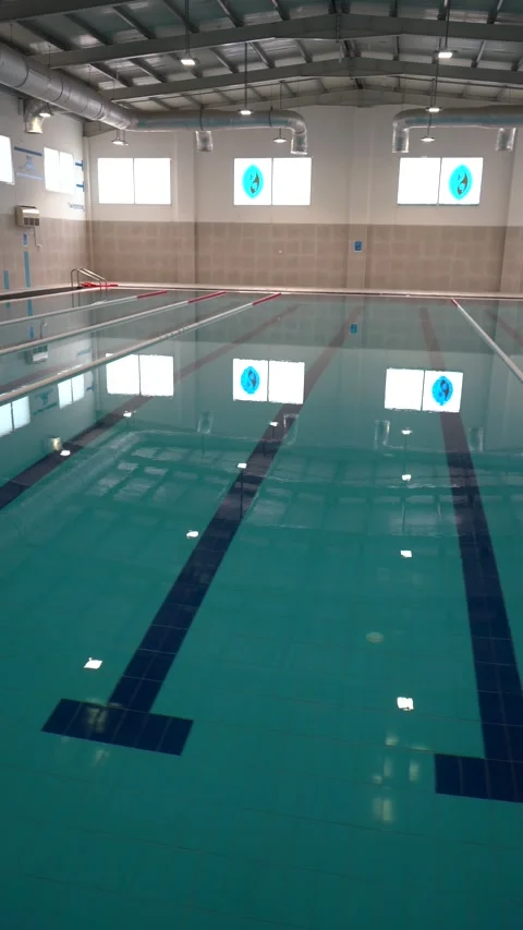View of an indoor swimming pool in Doha, Qatar. Stock Footage 339914797