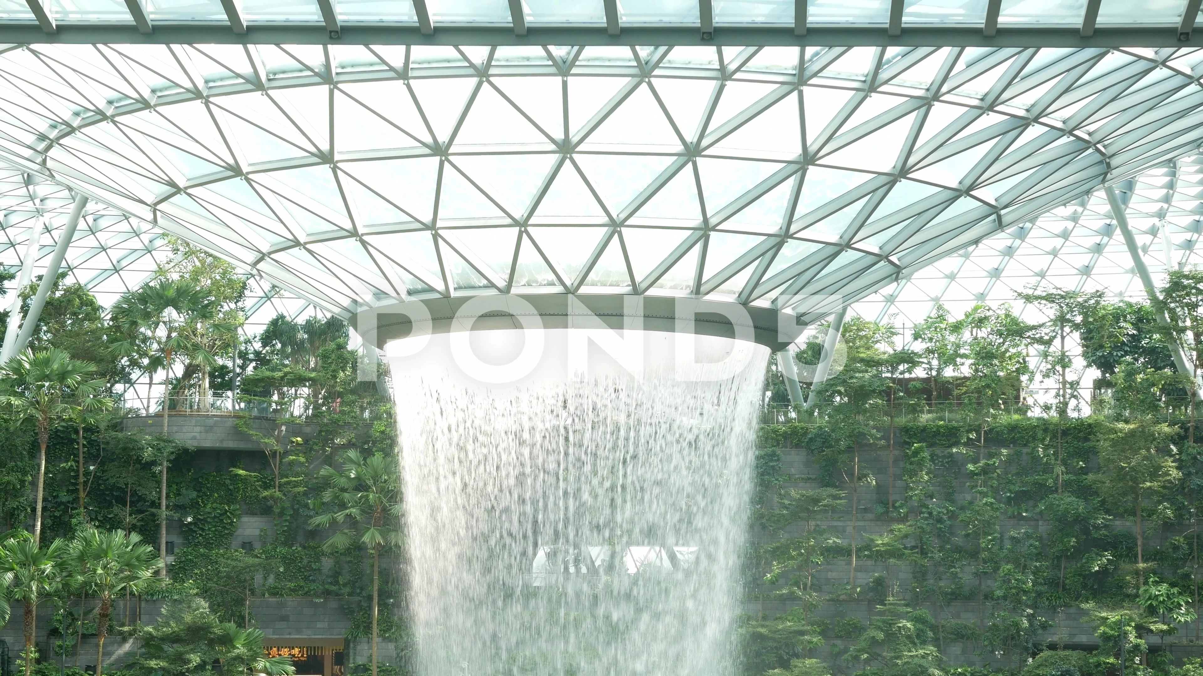 The Jewel waterfall monorail track gardens and visitors Changi