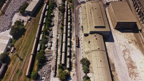 View of an industrial area with rail tracks and buildings during daytime Stock Footage 340382564