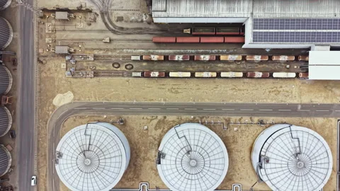 View of industrial area with silos and train cars in a rural location during Stock Footage 341107862