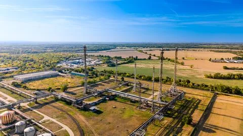 View of industrial facility and fields in daytime. An overview of an indust.. Stock Photos