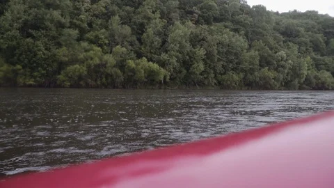 View from an inflatable boat to a mountain river with rain Stock Footage 120492786