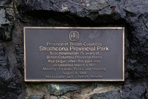 View of Information Board (Plaque) Strathcona Provincial Park on a stone wall Stock Photos