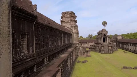 View of the inner yard of the ancient Khmer Capitol Angkor Wat at daytime Stock Footage 318720673