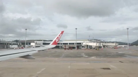 View from inside airplane airasia while operating at phuket airport reopening Stock Footage 200393971