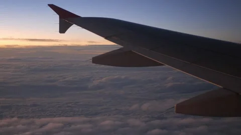 View inside airplane aircraft through window with wing view while flying in.. 스톡 동영상 313821367