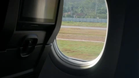 View inside airplane aircraft through plane window with aircraft seat in ca.. Video stock 315387722