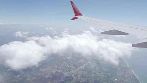 View inside airplane aircraft through window with wing view while flying in.. Vídeos de archivo 338331740