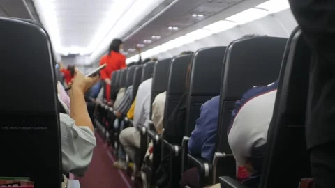 View inside airplane cabin full with passenger inside aircraft while travel.. Stock Footage 303646105