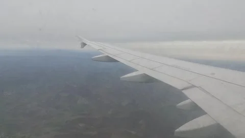 View Inside Airplane Fly Window Looking Outside 스톡 동영상 339976859