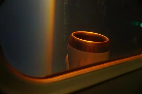 View from inside airplane to outside wing engine during dawn. Sun ray reflect Stock Photos