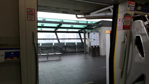 View from inside Airport MRT train doors at Taoyuan HSR Station A18 Taiwan Stock Footage 334228776