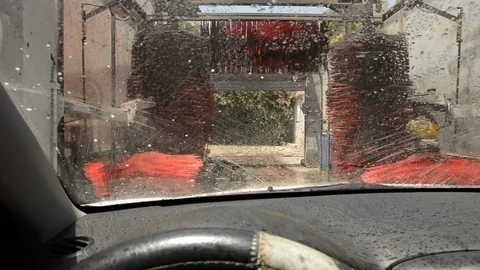 View of the inside of an automatic car wash from inside a vehicle Stock-Footage 93564826