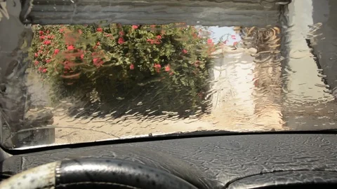 View of the inside of an automatic car wash from inside a vehicle 動画素材 93565046