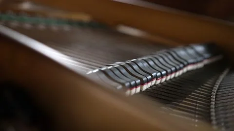 View inside a beautiful brown Grand Piano, hammers and strings moving as Video stock 153261297
