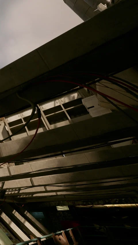 View from inside a building showing structural beams and wires Stock Footage 335693368