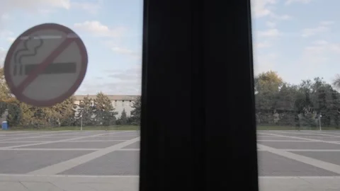 View from inside a bus through the doors about to open Stock Footage 253705328