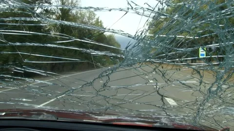 A view from the inside of a car driving on a road with Stock-Footage 133769349