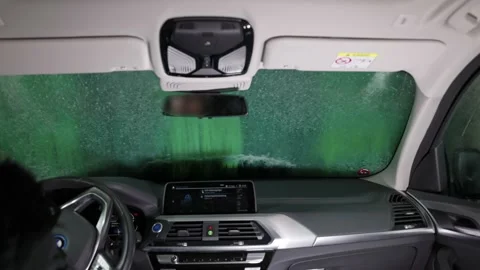 View from inside car during washing process on automatic washing station. Stock Footage 205510887