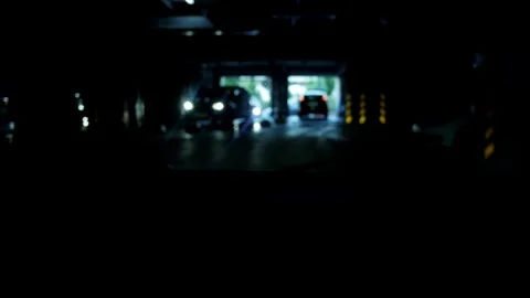View from inside the car. Entry and exit of cars from underground Parking lot of Stock Footage 276467815