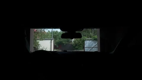View from inside car exiting home garage into sunny suburban street in summer Vídeos de archivo 339886237
