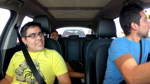 View inside the car of friends paying the toll traveling on vacation Stock Footage 197090864