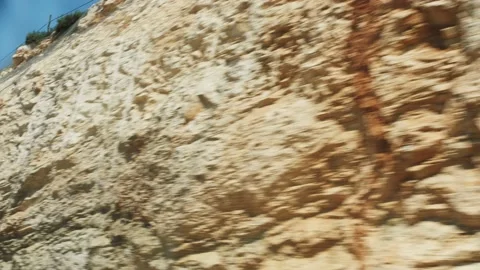 View inside car going down on road with rocky mountains. Stock Footage 205811248
