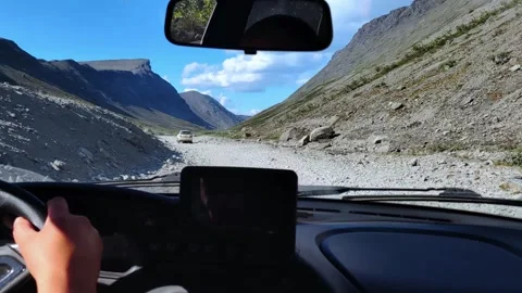 View from inside car on hilly road. Khibiny mountains. Off-road tour. Stock Footage 297434371