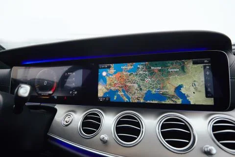 View from inside a car on a part of dashboard with a navigation unit and blurred 写真素材