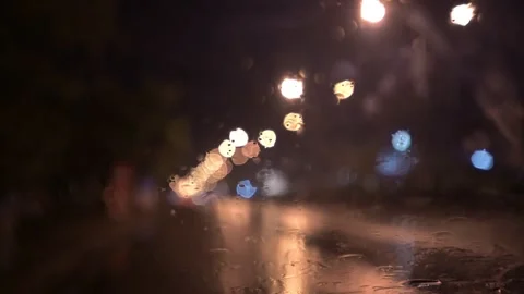 View from inside the car of Rainwater drops Falling Down On the car glass Stockbeeldmateriaal 251946000