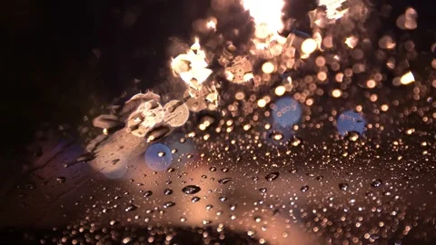 View from inside the car of Rainwater drops Falling Down On the car glass Stockbeeldmateriaal 251947051