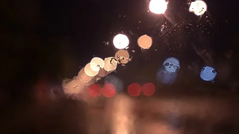 View from inside the car of Rainwater drops Falling Down On the car glass Stockbeeldmateriaal 251947815
