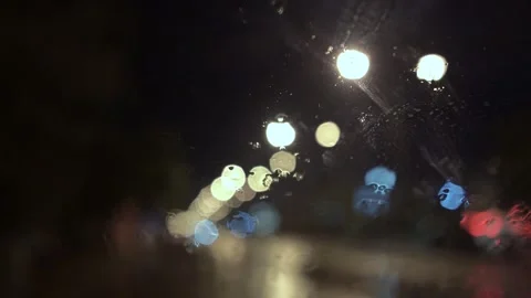 View from inside the car of Rainwater drops Falling Down On the car glass Stockbeeldmateriaal 251948374