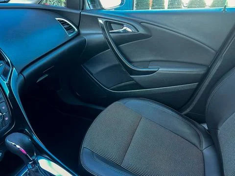 The view inside a car shows the driver seat and dashboard. The design feature Stock Photos