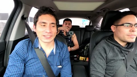 View from inside a car of three friends going on a trip and filming with their Stock Footage 155775739