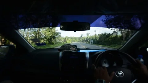 View from inside a car when driving while travelling in Thailand. Stock Footage 104038373