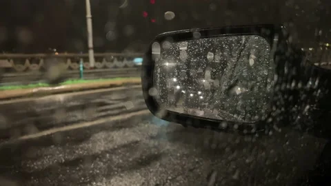 View from inside a car when a heavy rain is starting to fall near a promenade Stock Footage 164228268
