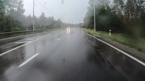 View from the inside of the car while drivig forward during hard rain. Stock Footage 145489946