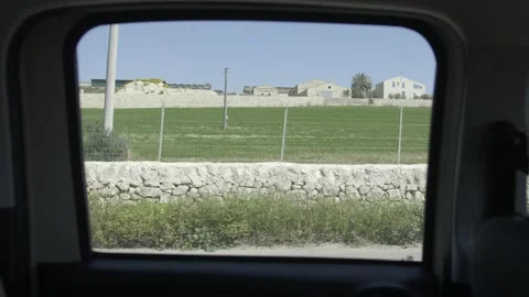 A view from inside the car with window frame and rural landscape Video stock 151541938