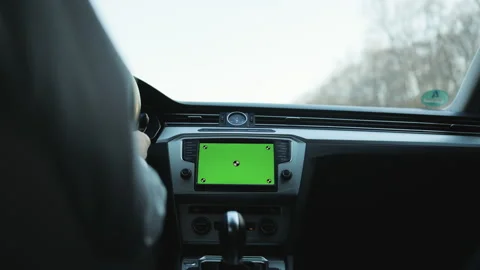 View inside car young man driving use navigation app on greenscreen mock-up Stock Footage 194715981