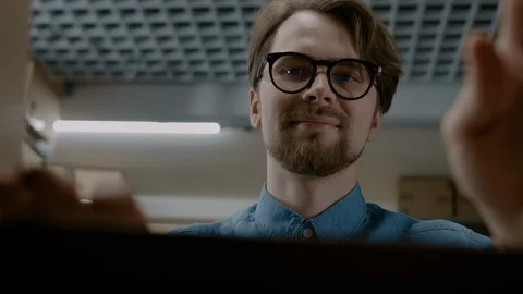 View from Inside Cardboard Package Box: Handsome Warehouse Worker Unboxes Parcel Stock Footage 96025602