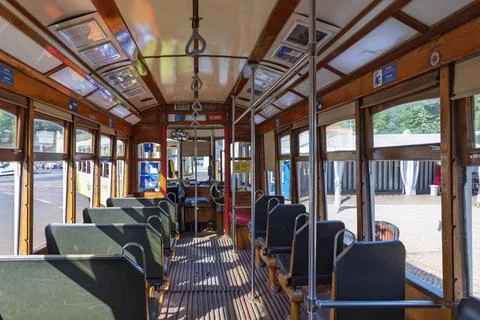 A view inside a classic, empty Tram 28 in Lisbon. The vintage wooden interior Stock Photos