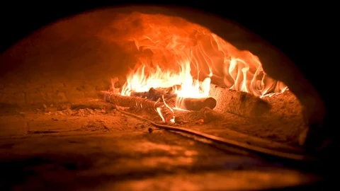 View inside a clay oven on fire with logs burning inside Stock Footage 126810717