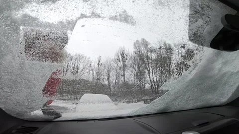 View from inside clean car of snow and ice Stock Footage 139284937