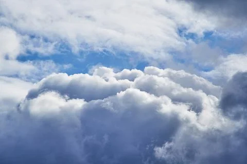 View inside a cloud at altitude, cloud and sky peering through it close-up, c Stock Photos
