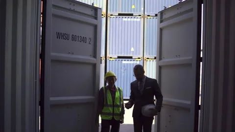 View from inside the container. Manager and senior engineers working at the w Stock Footage 171705810
